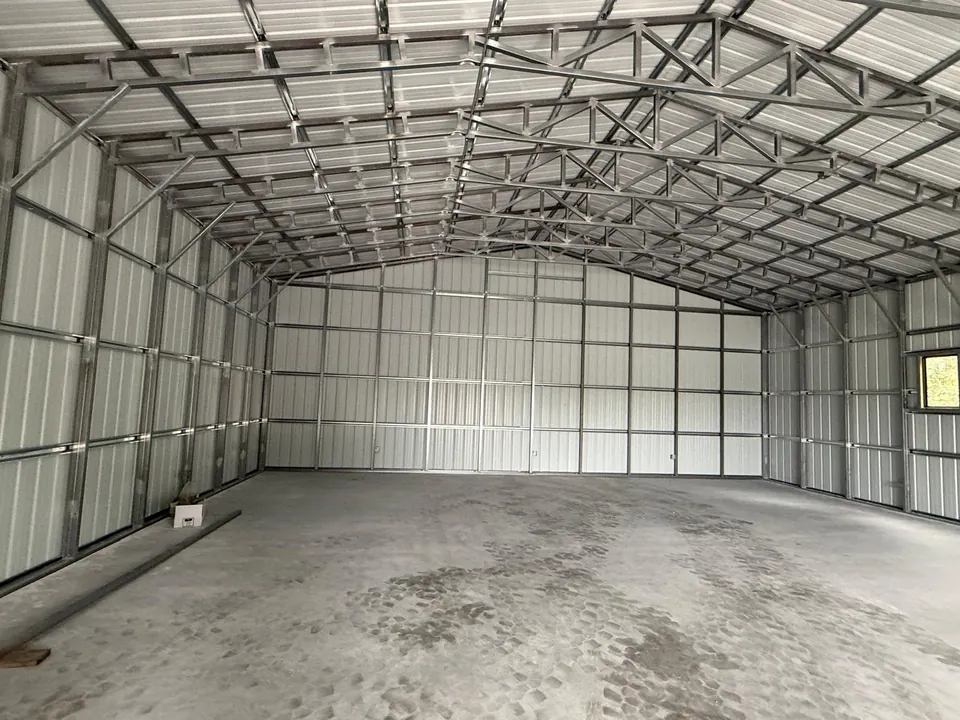 Commercial hangar enclosed with interior metal wall panels