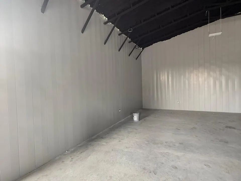Finished interior corner with light metal wall panels