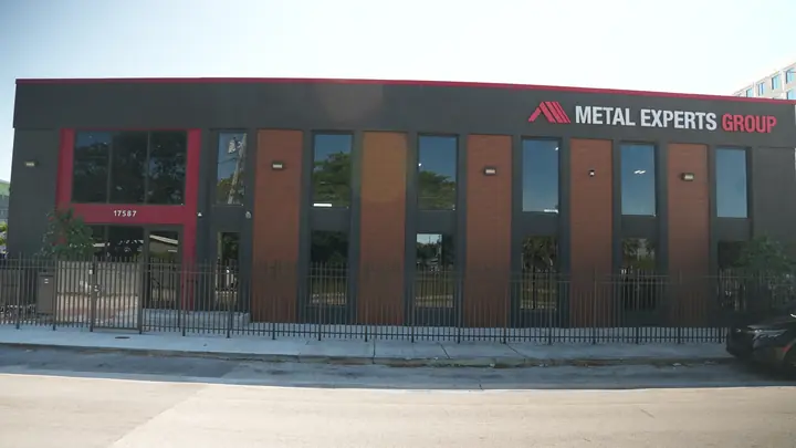 Long street elevation of the finished metal panel facade