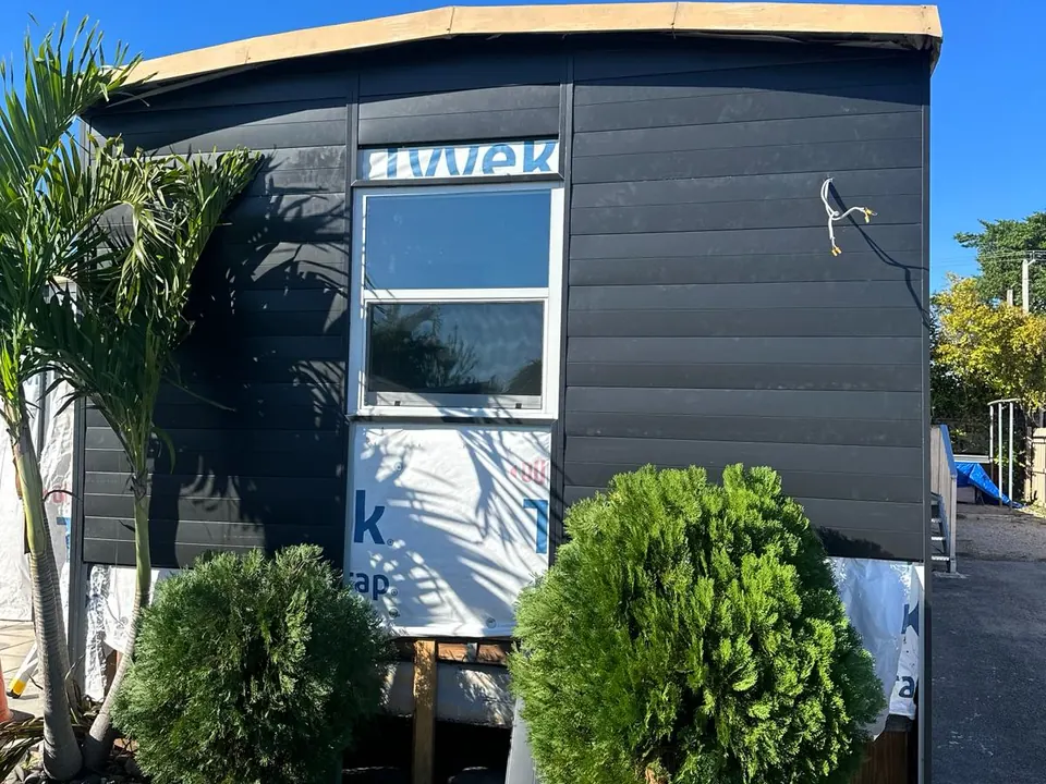 Front elevation during horizontal metal siding installation