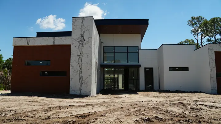 Modern building with brick-look metal cladding and wood-look aluminum soffit in South Florida