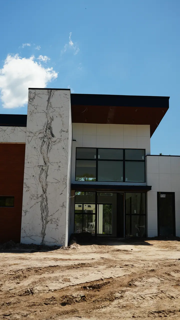 Window bay framed by cladding and dark trim